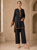 Black Leopard, a black block print raw silk tunic by Jannat and Sadaf