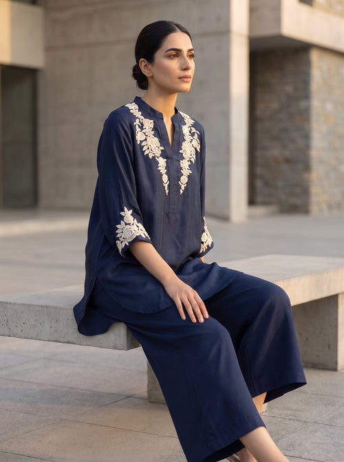 Blue Roses, an embroidered ocean blue raw silk co-ord by Jannat and Sadaf