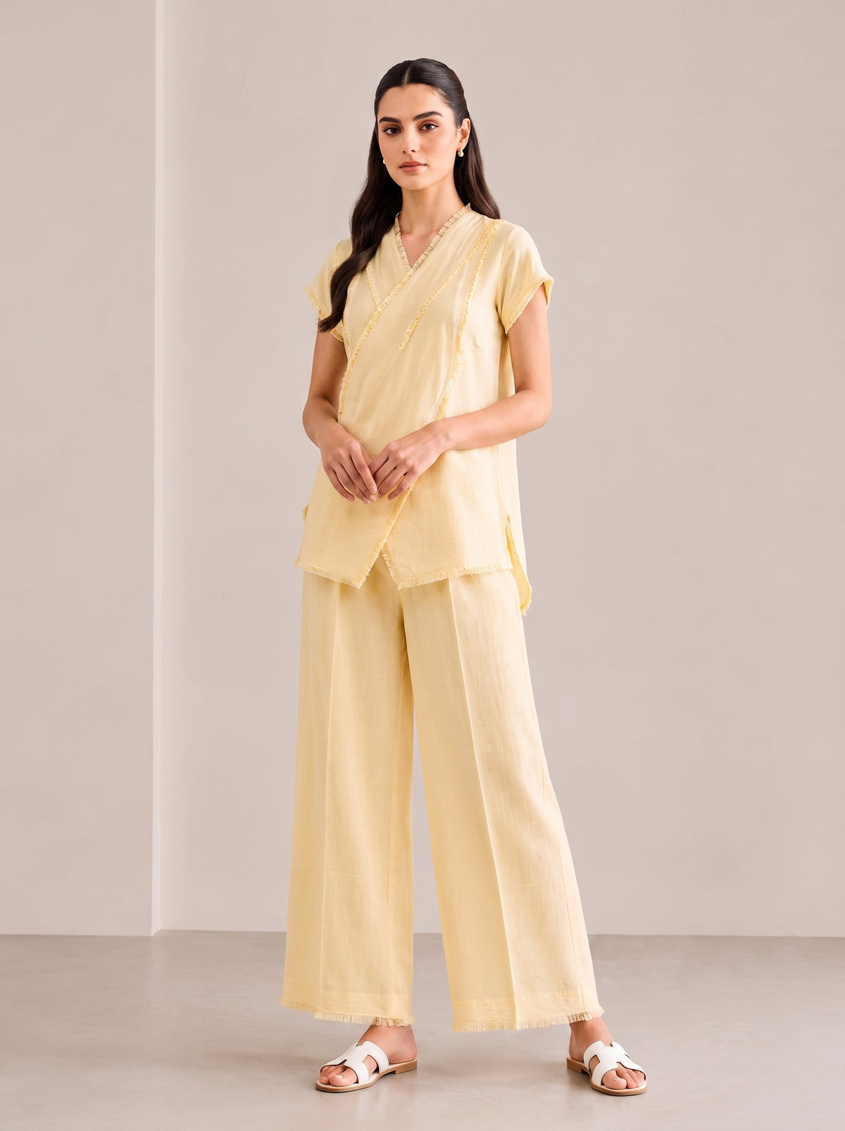 Buttercream Wrap, a lemon embroidered linen shirt by Jannat and Sadaf