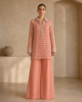 Peach Floret, a peach embellished net tunic by Jannat and Sadaf