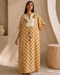 Saffron Check, a mustard block print silk kaftan by Jannat and Sadaf