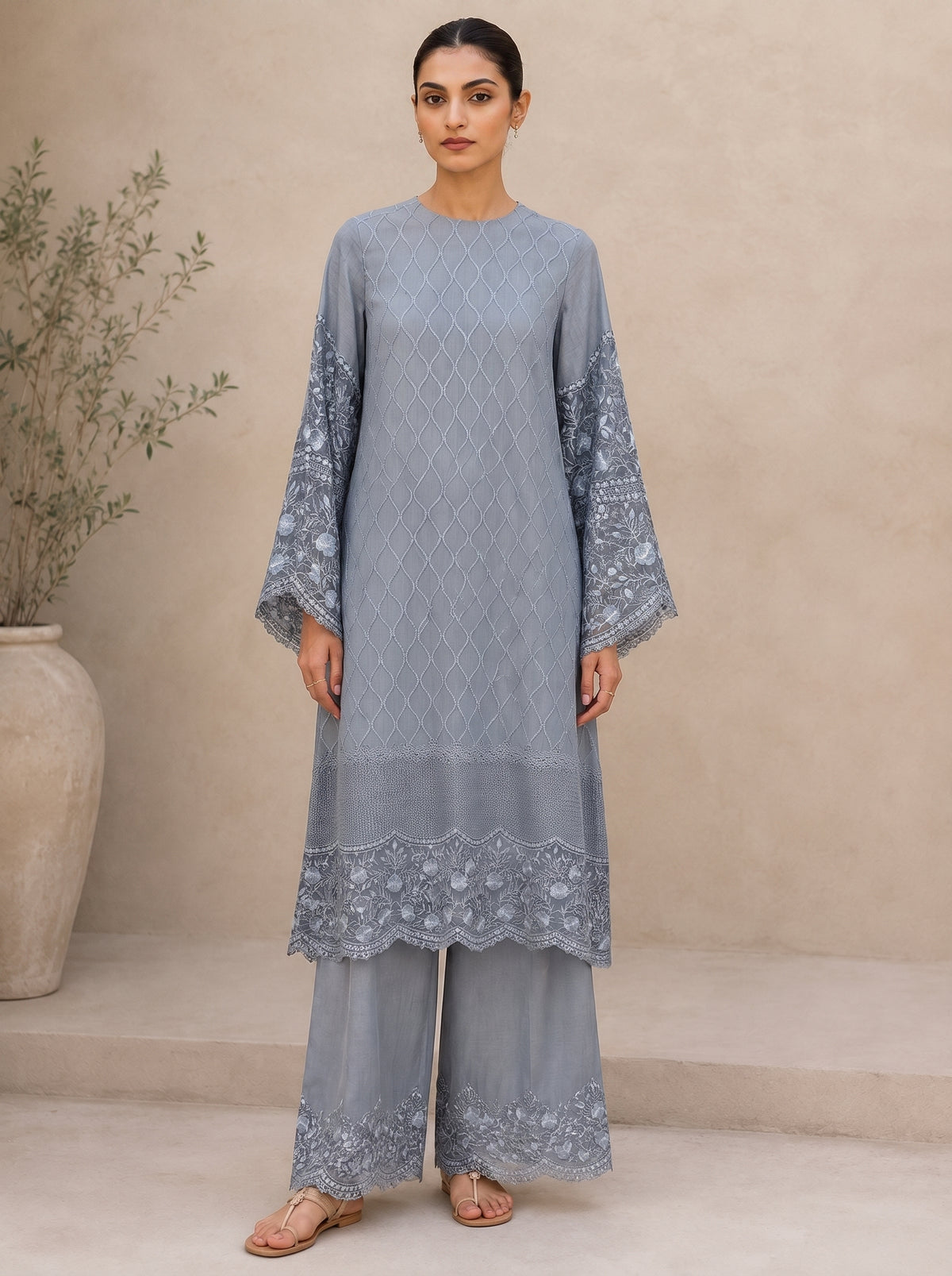 Slate Whisper, a dusty blue embroidered lace silk set by Jannat and Sadaf